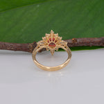 14K yellow gold padparadscha sapphire ring with diamond accents