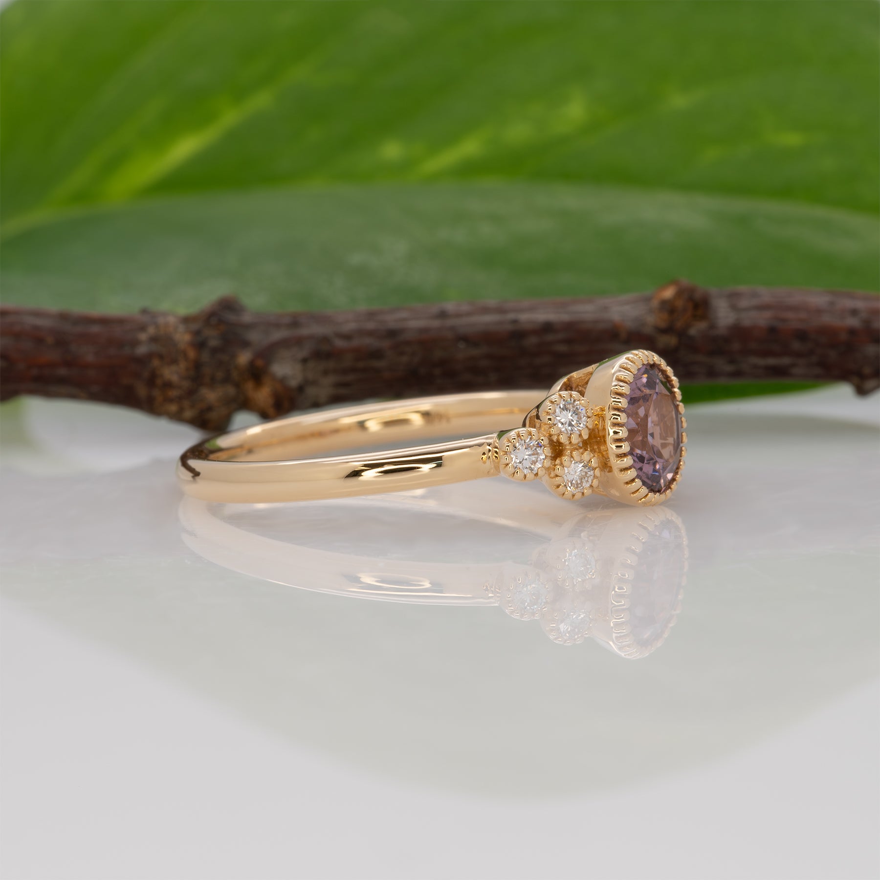 14K yellow gold purple spinel round ring with diamond accents