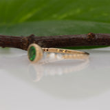 14K yellow gold tsavorite garnet round ring with diamond accents