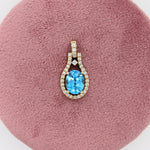 Pendants-Pretty Swiss Topaz Pendant in Solid 14K Yellow Gold with Diamond Accents | Oval 9x7mm | December Birthstone | Blue Gemstone | Ready to Ship - NNJGemstones