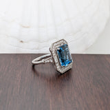 Glamorous London Blue Topaz Ring with All Natural Diamond Pave Halo in Solid 14K White Gold | Emerald Cut 12x10mm | December Birthstone