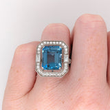 Glamorous London Blue Topaz Ring with All Natural Diamond Pave Halo in Solid 14K White Gold | Emerald Cut 12x10mm | December Birthstone